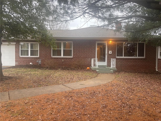 single story home featuring a garage