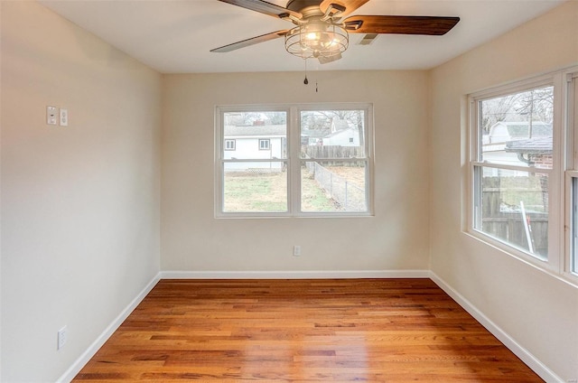 empty room with light hardwood / wood-style floors and ceiling fan