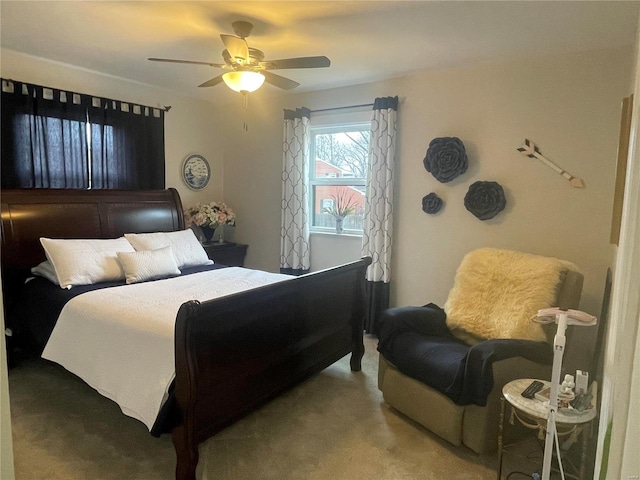 bedroom featuring ceiling fan and carpet