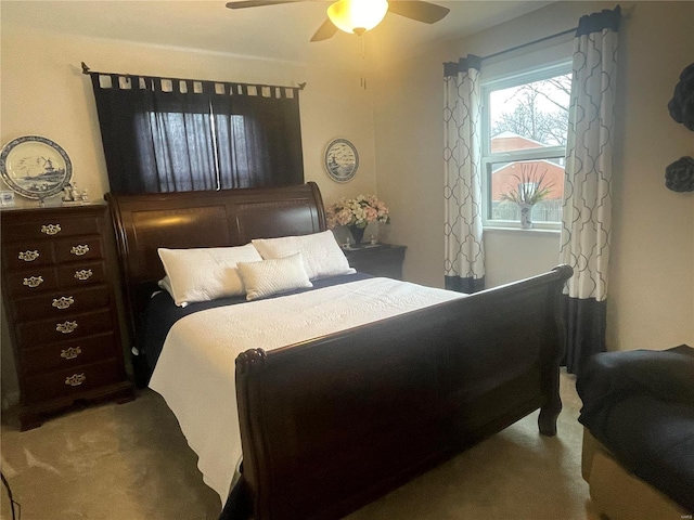 bedroom with ceiling fan and carpet