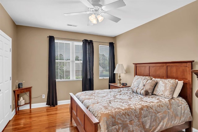 bedroom featuring light hardwood / wood-style floors and ceiling fan