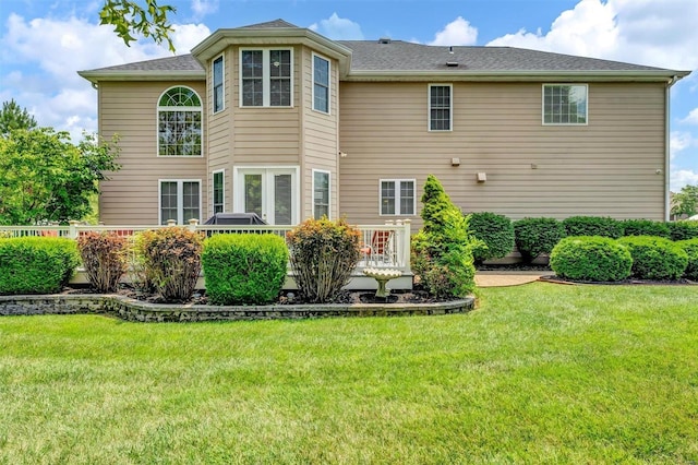 rear view of house with a lawn