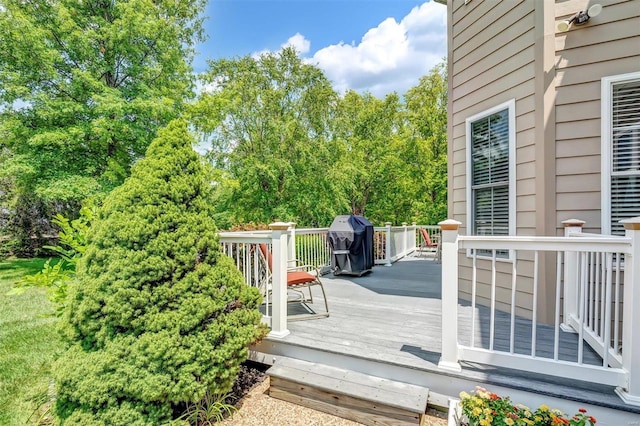 wooden terrace with area for grilling