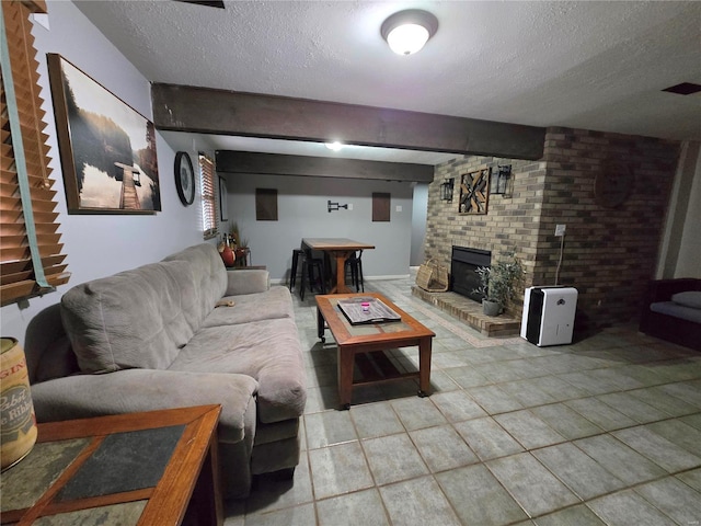 tiled living room with beamed ceiling and a textured ceiling