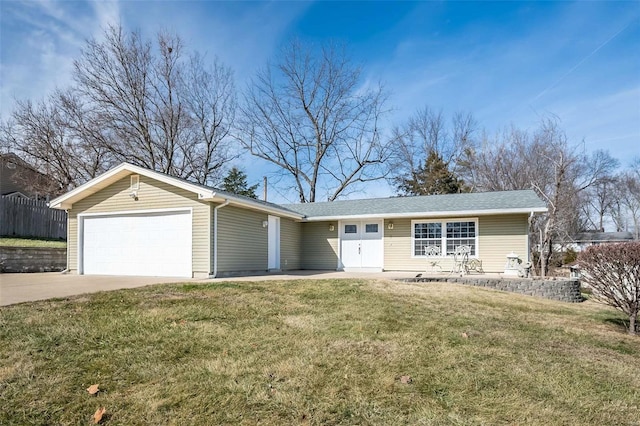 ranch-style house with a garage and a front yard