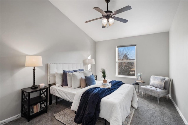 bedroom featuring lofted ceiling, dark carpet, and ceiling fan