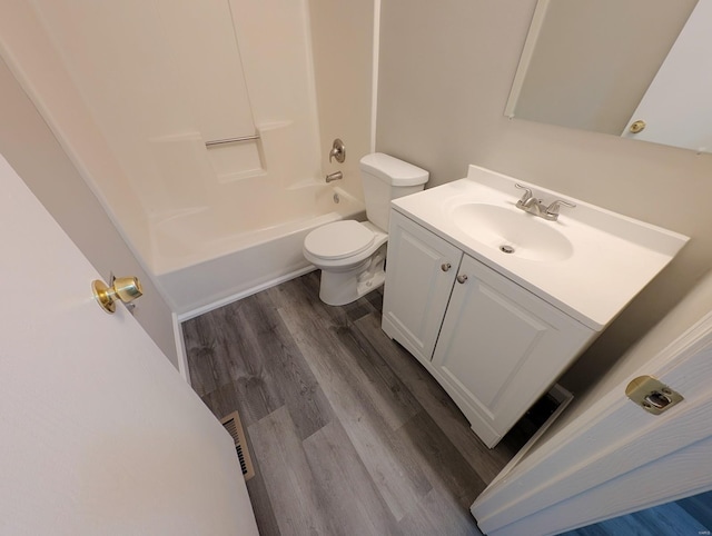 full bathroom featuring bathtub / shower combination, vanity, toilet, and hardwood / wood-style floors