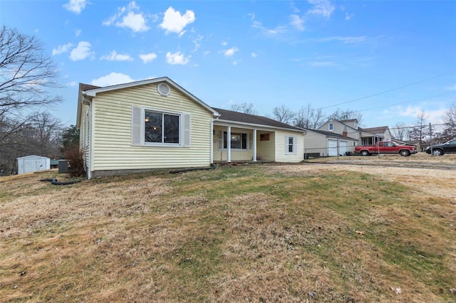 single story home featuring a front lawn and central air condition unit