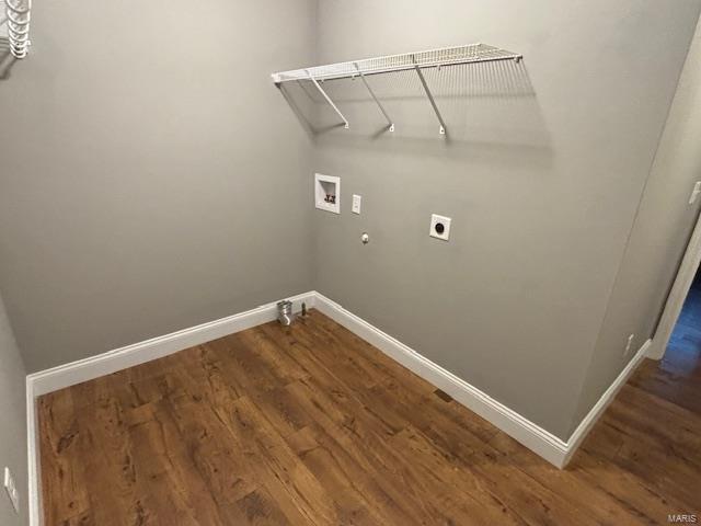 laundry area featuring washer hookup, hookup for a gas dryer, dark wood-type flooring, and hookup for an electric dryer