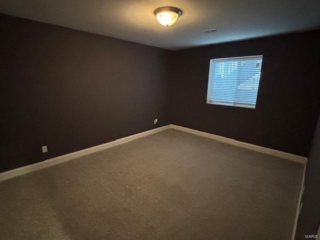 empty room with carpet flooring