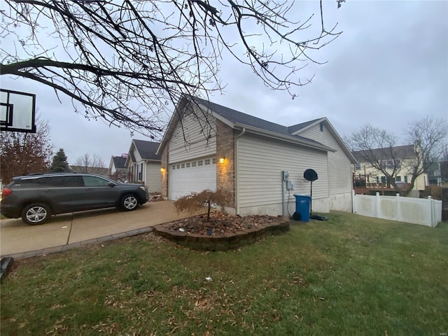 view of property exterior featuring a garage and a yard