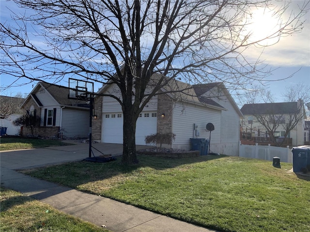 view of side of property with a garage and a lawn