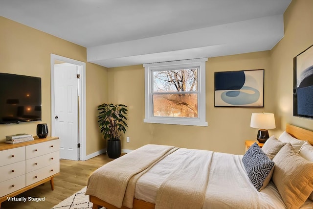 bedroom featuring light wood-type flooring