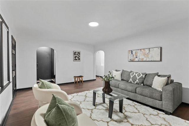 living room with dark hardwood / wood-style floors