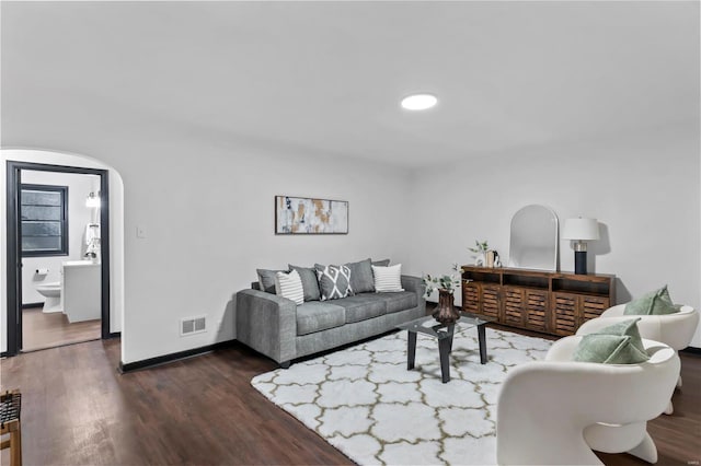 living room featuring dark hardwood / wood-style floors