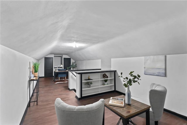 interior space featuring dark hardwood / wood-style floors and vaulted ceiling