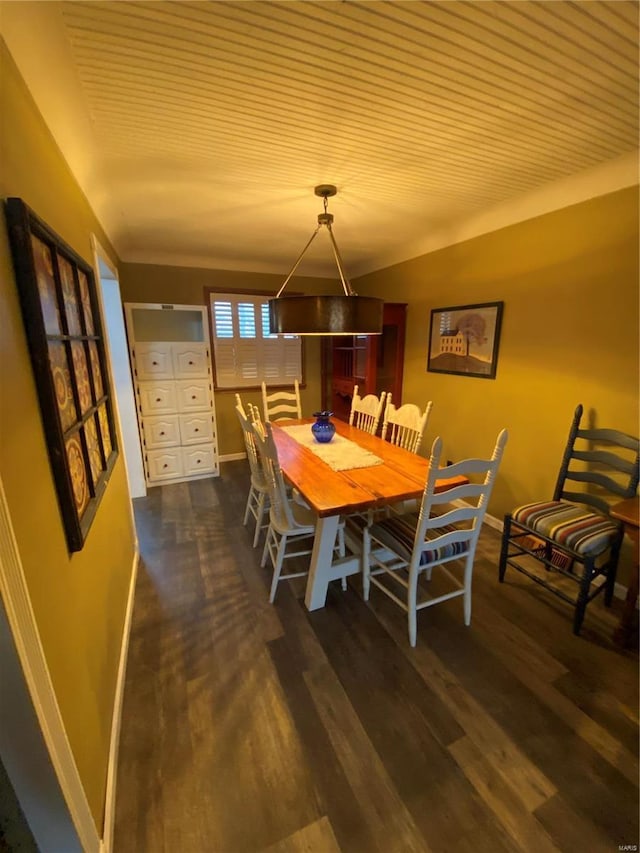 dining area featuring dark hardwood / wood-style floors