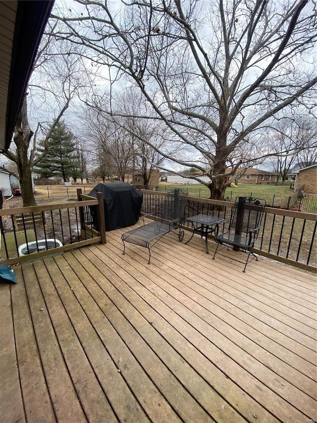 wooden deck featuring area for grilling