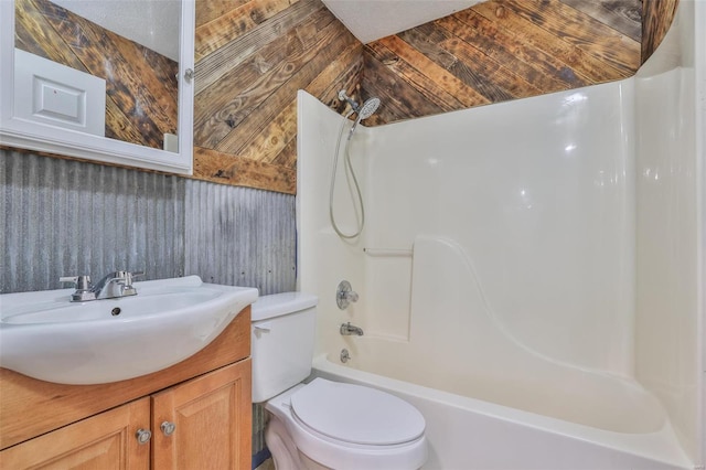 full bathroom with vanity, shower / tub combination, and toilet