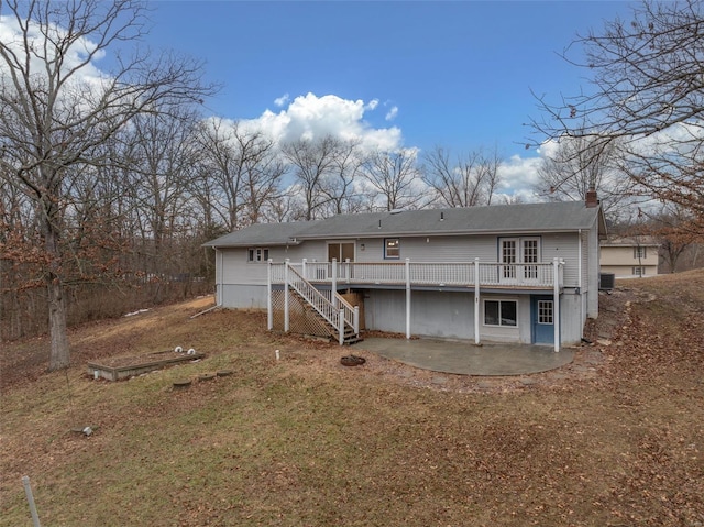 back of house with a patio, a deck, a yard, central AC unit, and french doors