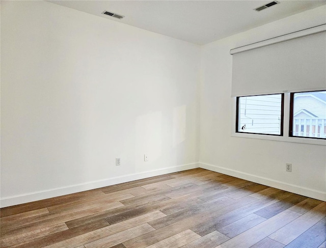 unfurnished room featuring light wood-type flooring