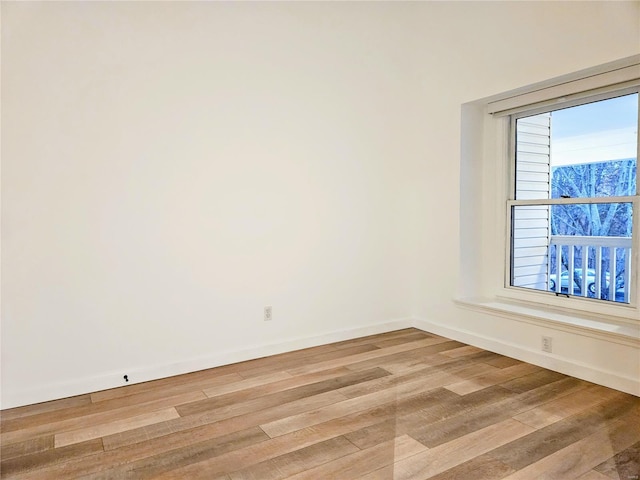 unfurnished room with a wealth of natural light and light wood-type flooring