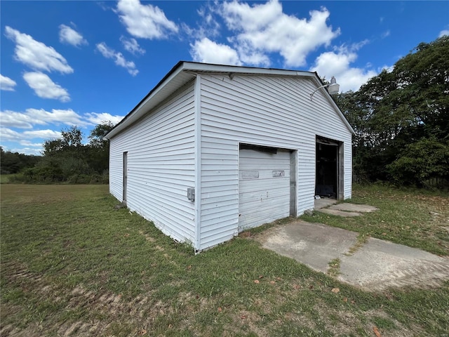 garage featuring a yard