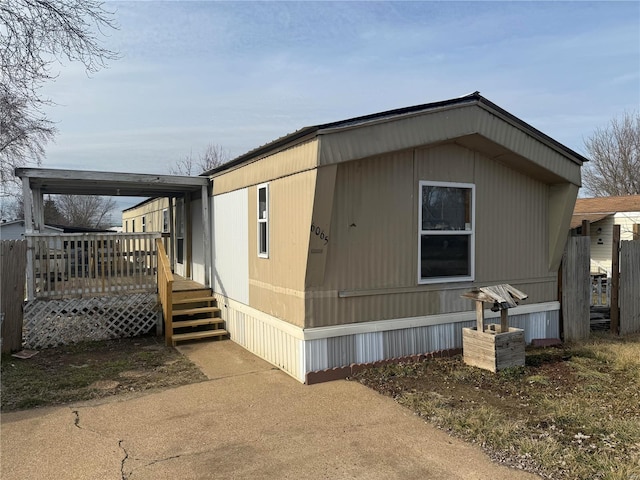 view of side of home with a deck