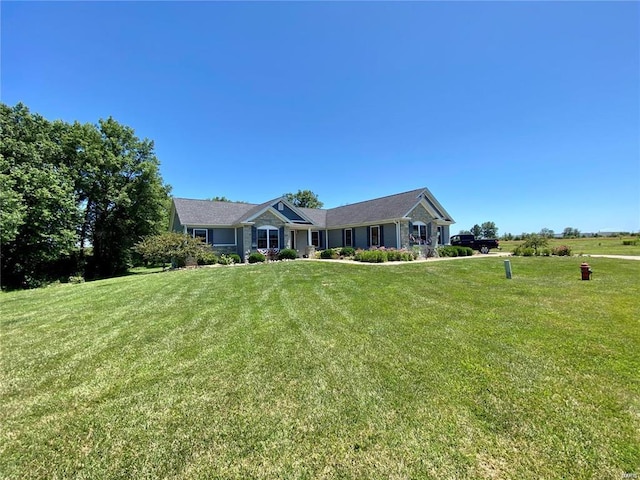 ranch-style home with a front lawn