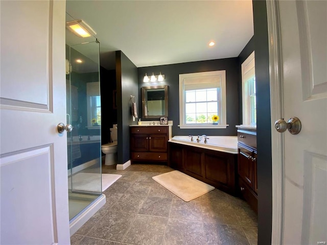 full bathroom featuring vanity, toilet, and separate shower and tub