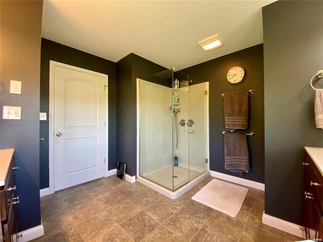 bathroom with vanity and a shower with shower door