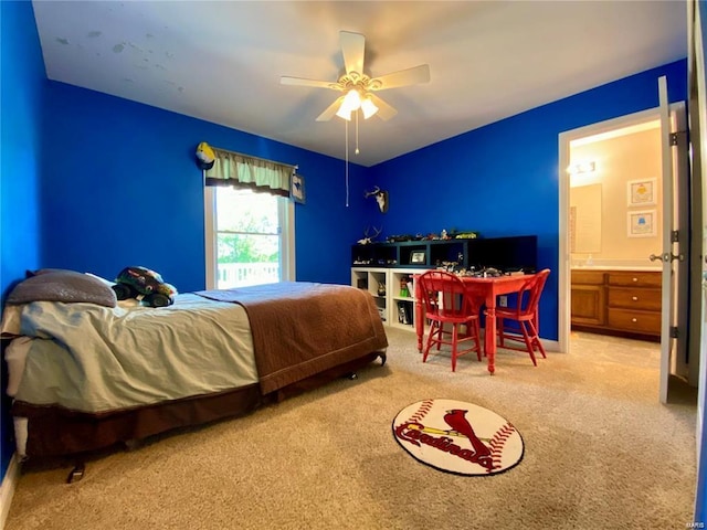 carpeted bedroom with ceiling fan and connected bathroom