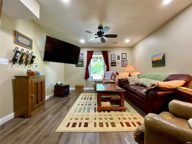 living room with hardwood / wood-style floors and ceiling fan