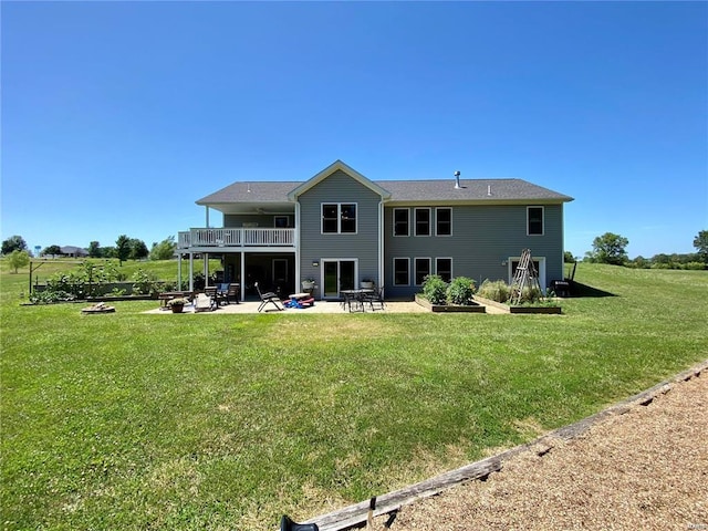 back of house with a lawn and a patio