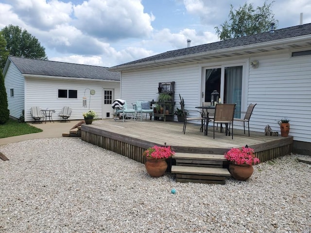 rear view of property with a wooden deck