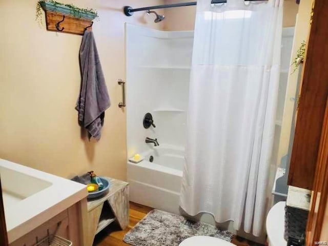 full bathroom with toilet, vanity, and shower / bathtub combination with curtain