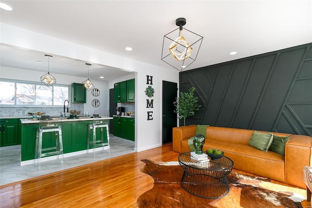 living room with beverage cooler and light wood-type flooring