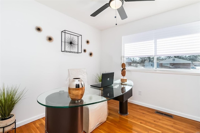 office area featuring light hardwood / wood-style floors and ceiling fan