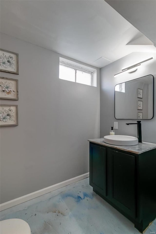 bathroom featuring vanity and concrete flooring