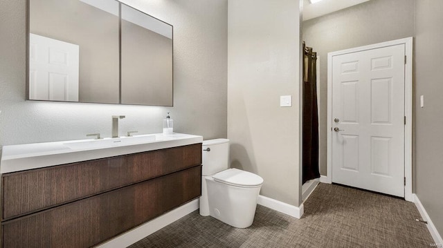 bathroom with tile patterned floors, vanity, toilet, and a shower with shower curtain