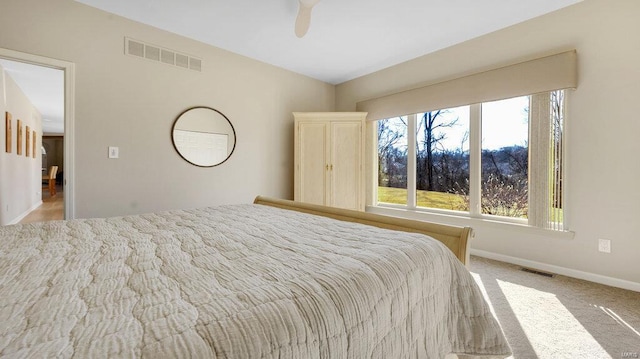 carpeted bedroom with ceiling fan