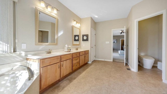 bathroom with vanity, ceiling fan, and toilet