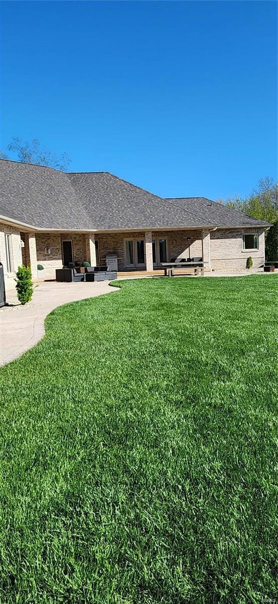 exterior space featuring a yard and a patio