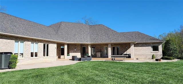 back of property featuring a patio, a yard, and cooling unit