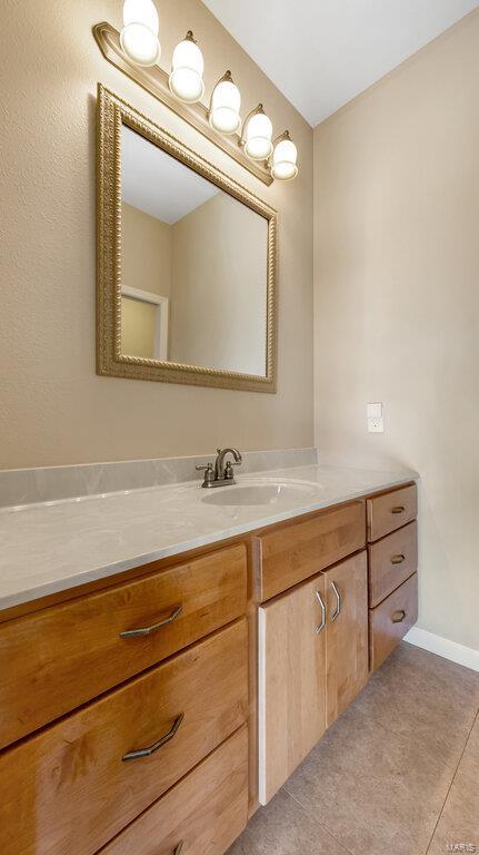 bathroom featuring vanity and tile patterned floors