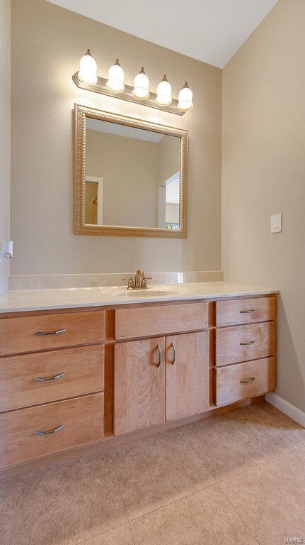 bathroom with vanity and tile patterned flooring