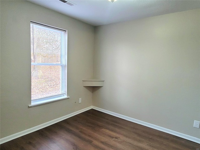 unfurnished room featuring dark hardwood / wood-style floors