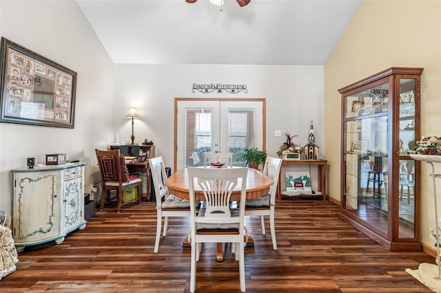 dining space with lofted ceiling, dark hardwood / wood-style floors, and french doors