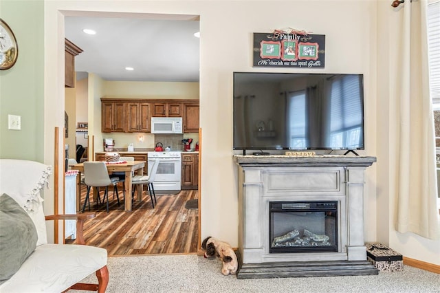 kitchen featuring dark wood-type flooring and white appliances