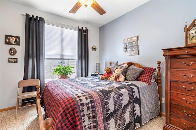 bedroom featuring ceiling fan and light carpet